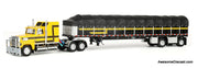 Ford LTL 9000 Sleeper Tractor w/53ft Wilson Roadbrute Flatbed Trailer & Covered Wagon, Yellow/Black 1:64 Diecast Model Truck DCP by FG